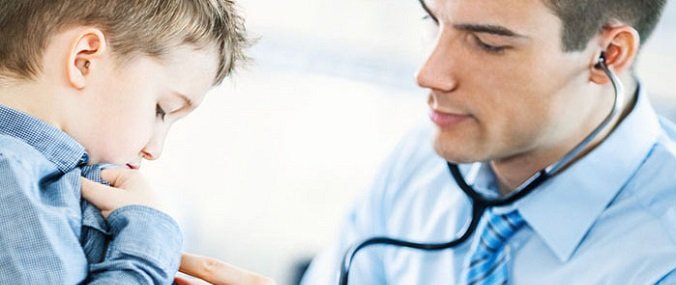 A child getting a check-up from a GP