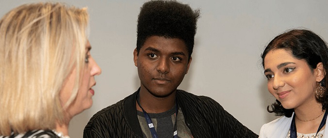 Three young people in conversation