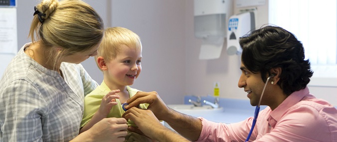 A parent and child talking to a doctor